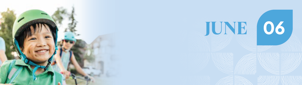 Baner for June. Toward the left, a boy is wearing a bicycle helmet and smiling. His friends are in the background out of focus.